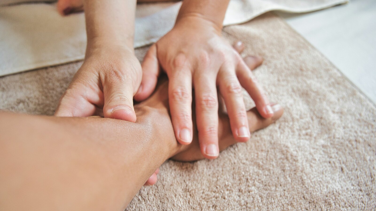 A therapist gives an unhurried Ayurvedic oil massage